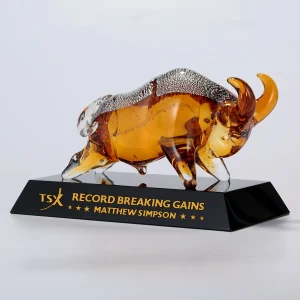 gold charging bull art glass award