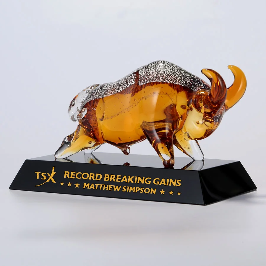 gold charging bull art glass award