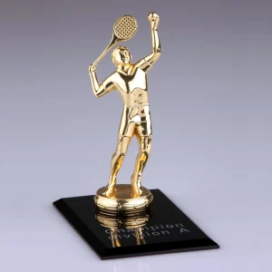 golden metal tennis player award with black crystal base
