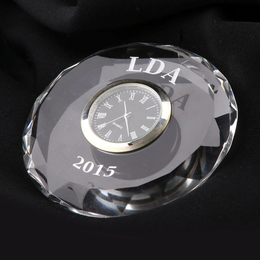 multi faceted round crystal paperweight with clock